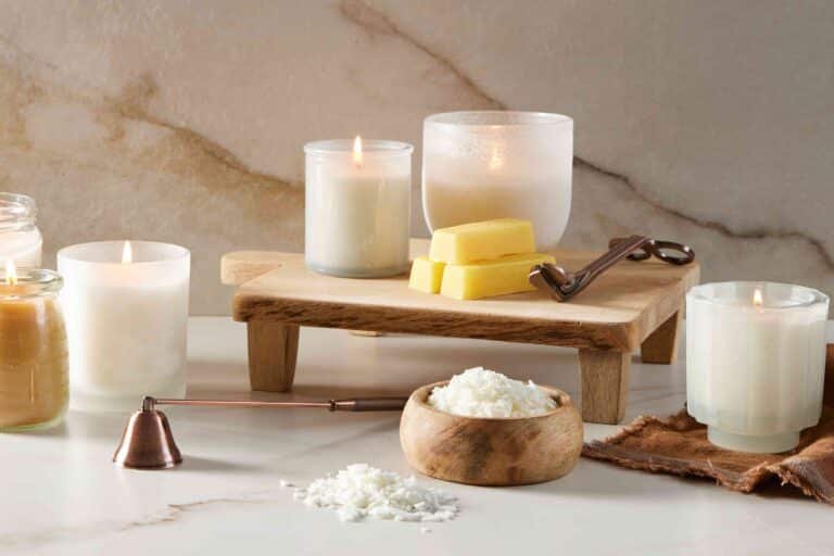 What are the common types of natural waxes used in scented candles?
